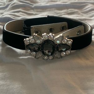 Black leather belt with gems in the center